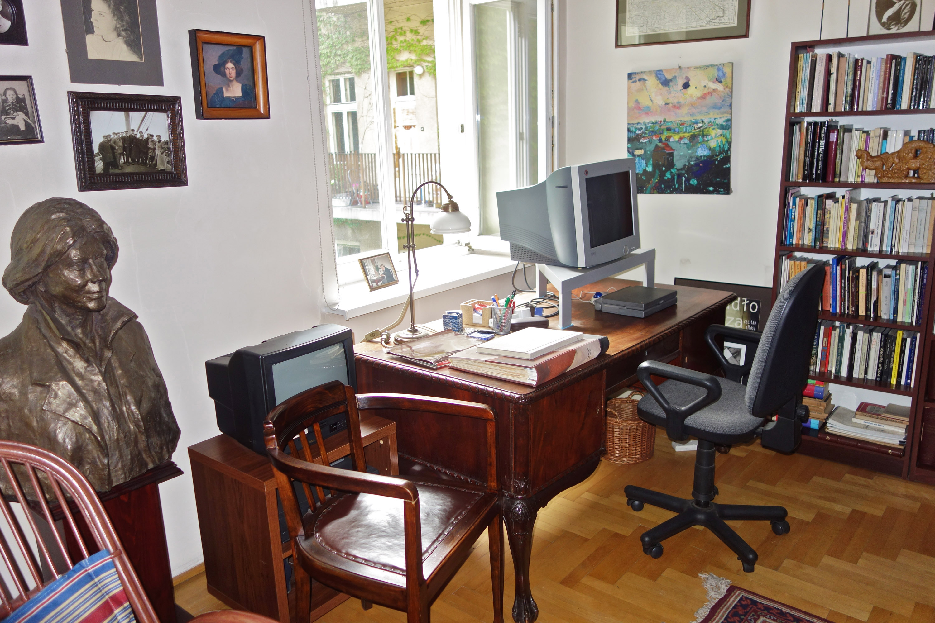 Czeslaw Milosz- reciepient of Nobel Prize in Literature in 1980, his former apartment in Krakow. Desk on which he wrote. Near left is bust of his second wife, Carol Thigpen. Krakow/Poland. 8.13.20016