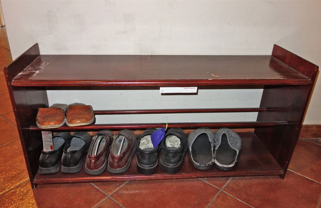 Czeslaw Milosz's, Nobel Lureat in Literaturte, apartment. Bench with poet's shoes and slippers.